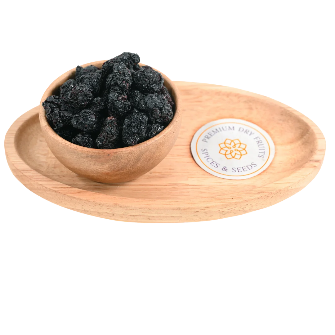Premium blackberries dried in a wooden bowl, showcasing their dark purple-black color and wrinkled texture.
