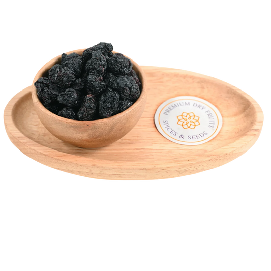 Premium blackberries dried in a wooden bowl, showcasing their dark purple-black color and wrinkled texture.