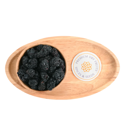 Close-up of whole blackberries dried with a rich, deep hue and naturally glossy surface.
