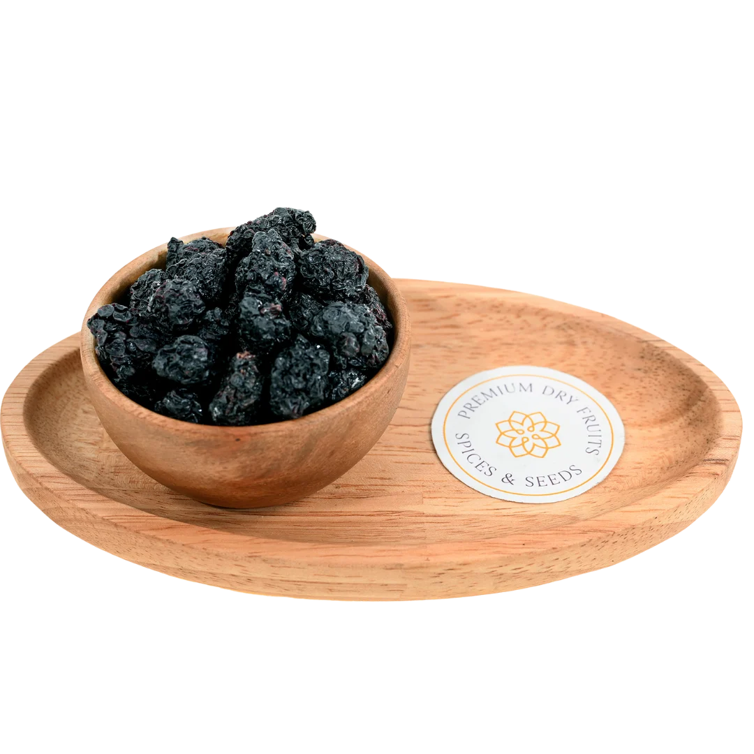 Naturally blackberries dried displayed in a rustic wooden bowl, highlighting their premium quality and bold color.