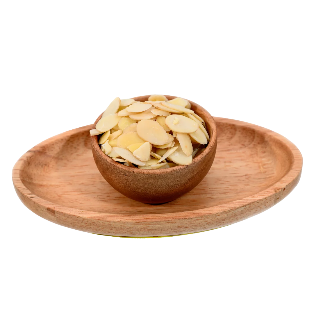 Blanched Sliced Almonds Badam finely cut flakes in wooden bowl – nutritious dry fruits topping for sweets cakes and healthy meals