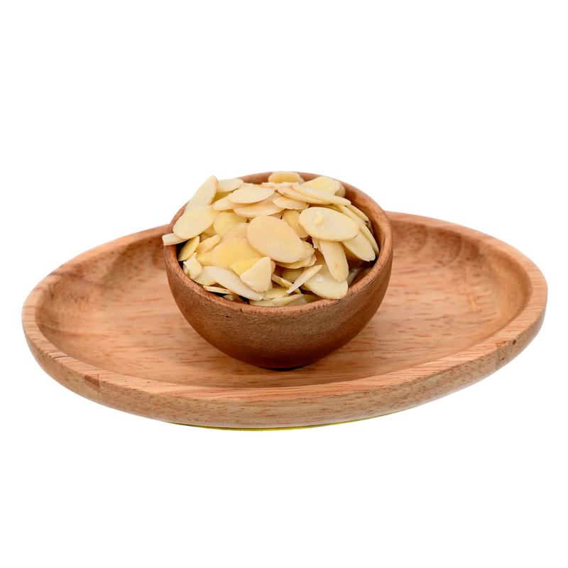 Blanched Sliced Almonds Badam finely cut flakes in wooden bowl – nutritious dry fruits topping for sweets cakes and healthy meals