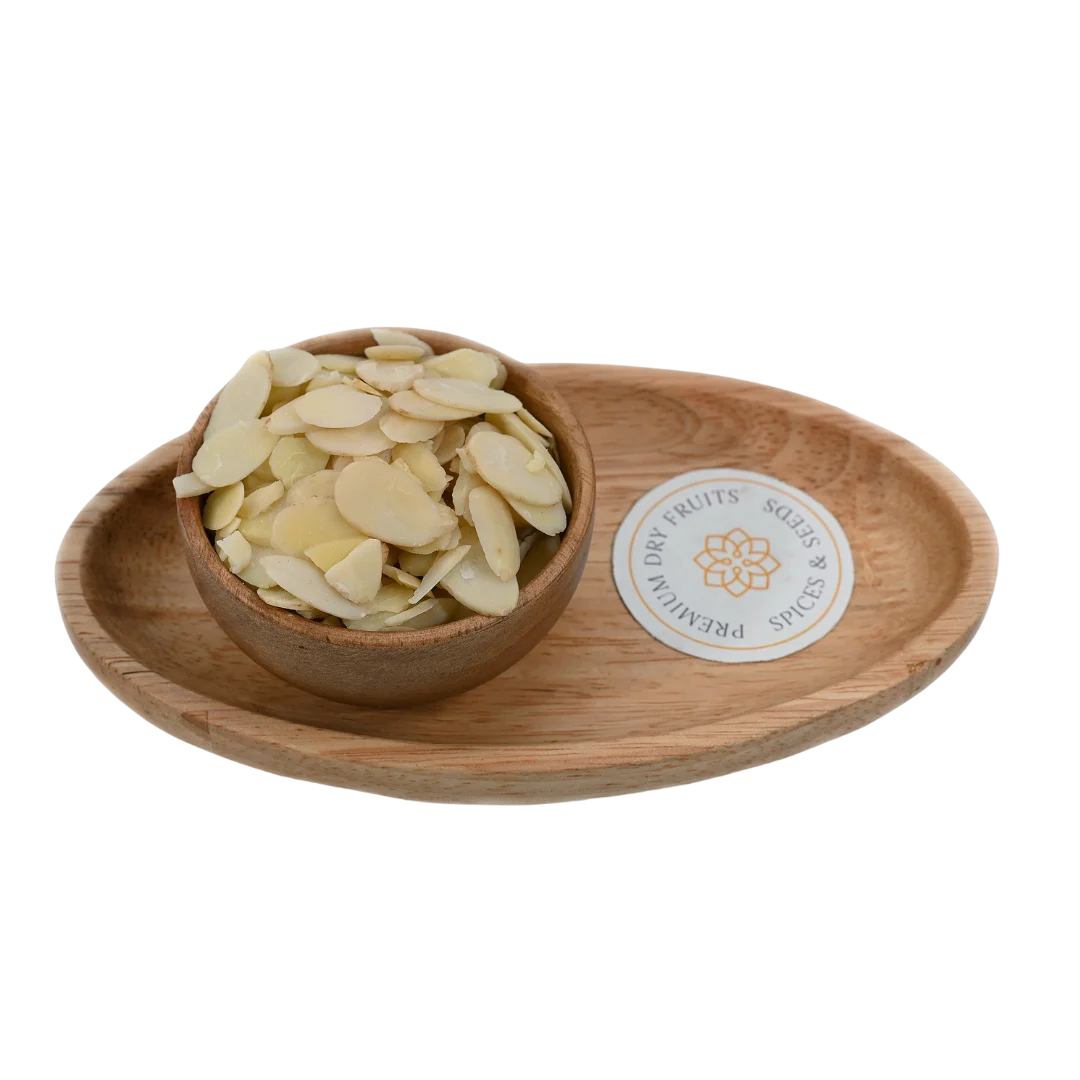 Blanched Sliced Almonds Badam in wooden bowl – premium thin almond flakes rich in protein and vitamin E for healthy snacking