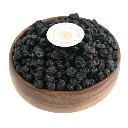 Blueberries Dried Whole Premium in a wooden bowl, showcasing their deep blue color and glossy finish.