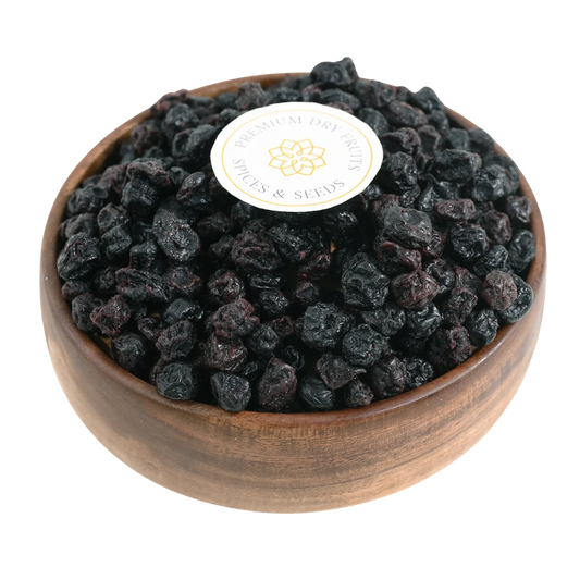 Blueberries Dried Whole Premium in a wooden bowl, showcasing their deep blue color and glossy finish.