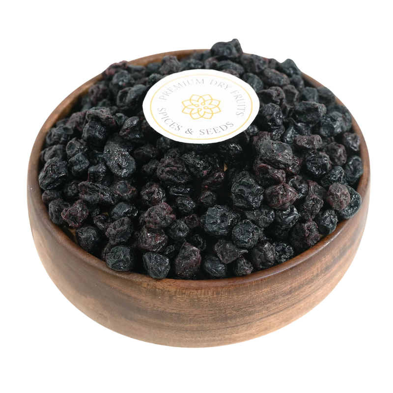 Blueberries Dried Whole Premium in a wooden bowl, showcasing their deep blue color and glossy finish.