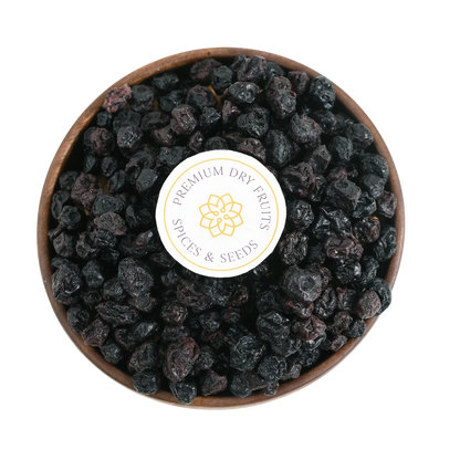 Close-up of Blueberries Dried Whole Premium with a rich, dark hue and plump texture, displayed in a rustic bowl.