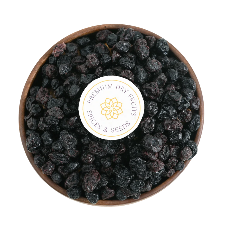 Close-up of Blueberries Dried Whole Premium with a rich, dark hue and plump texture, displayed in a rustic bowl.