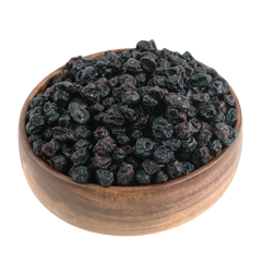 Naturally dried whole blueberries presented in a wooden bowl, highlighting their premium quality and vibrant tone.