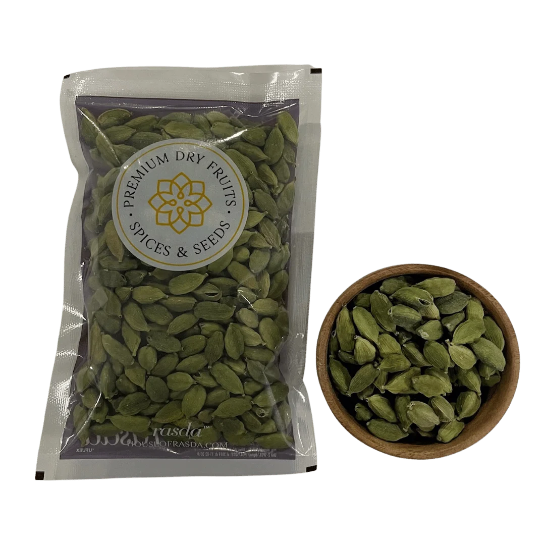 Packaged cardamom seeds with a bowl of cardamom seeds on a white background