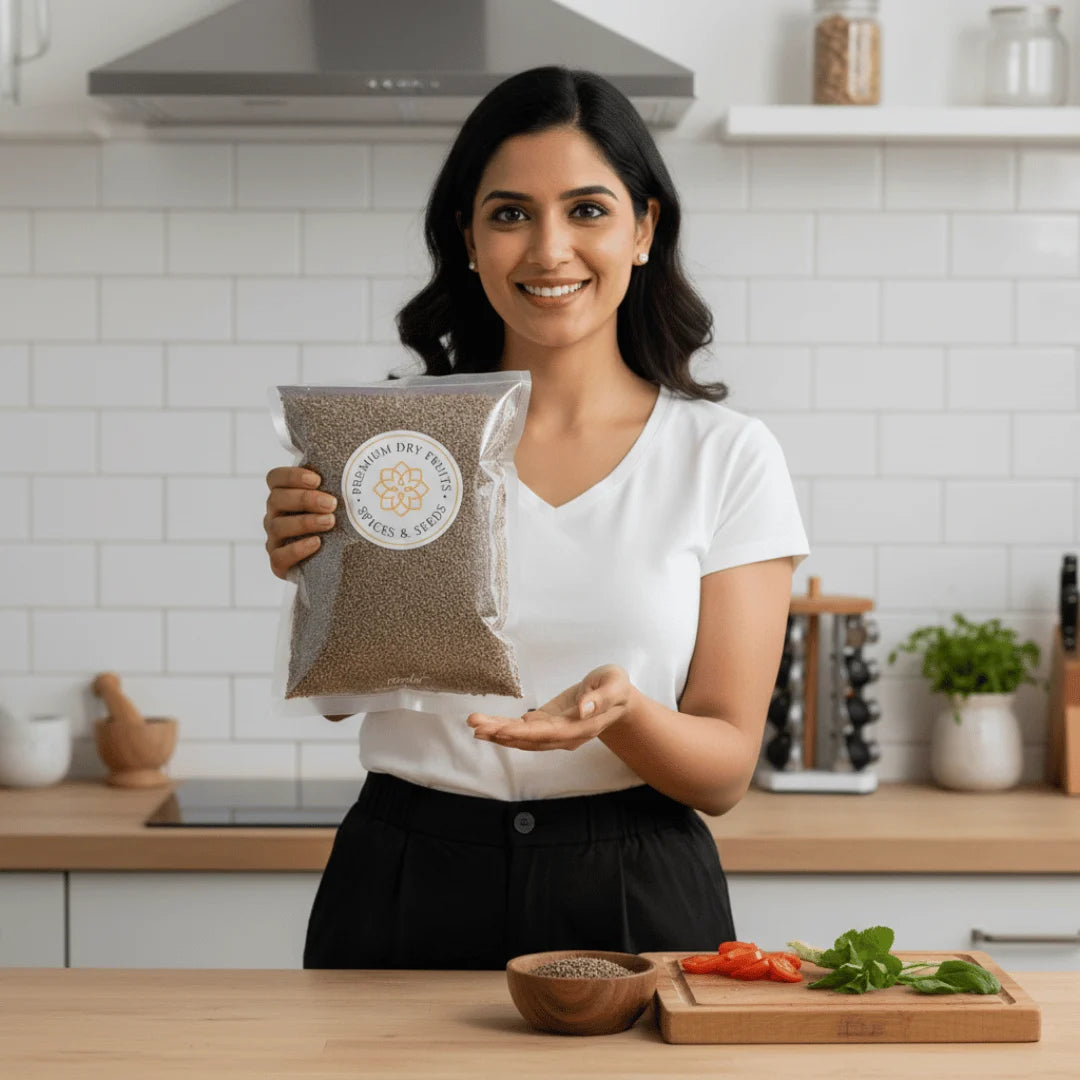 Woman holding a package of Carom Seeds in a kitchen