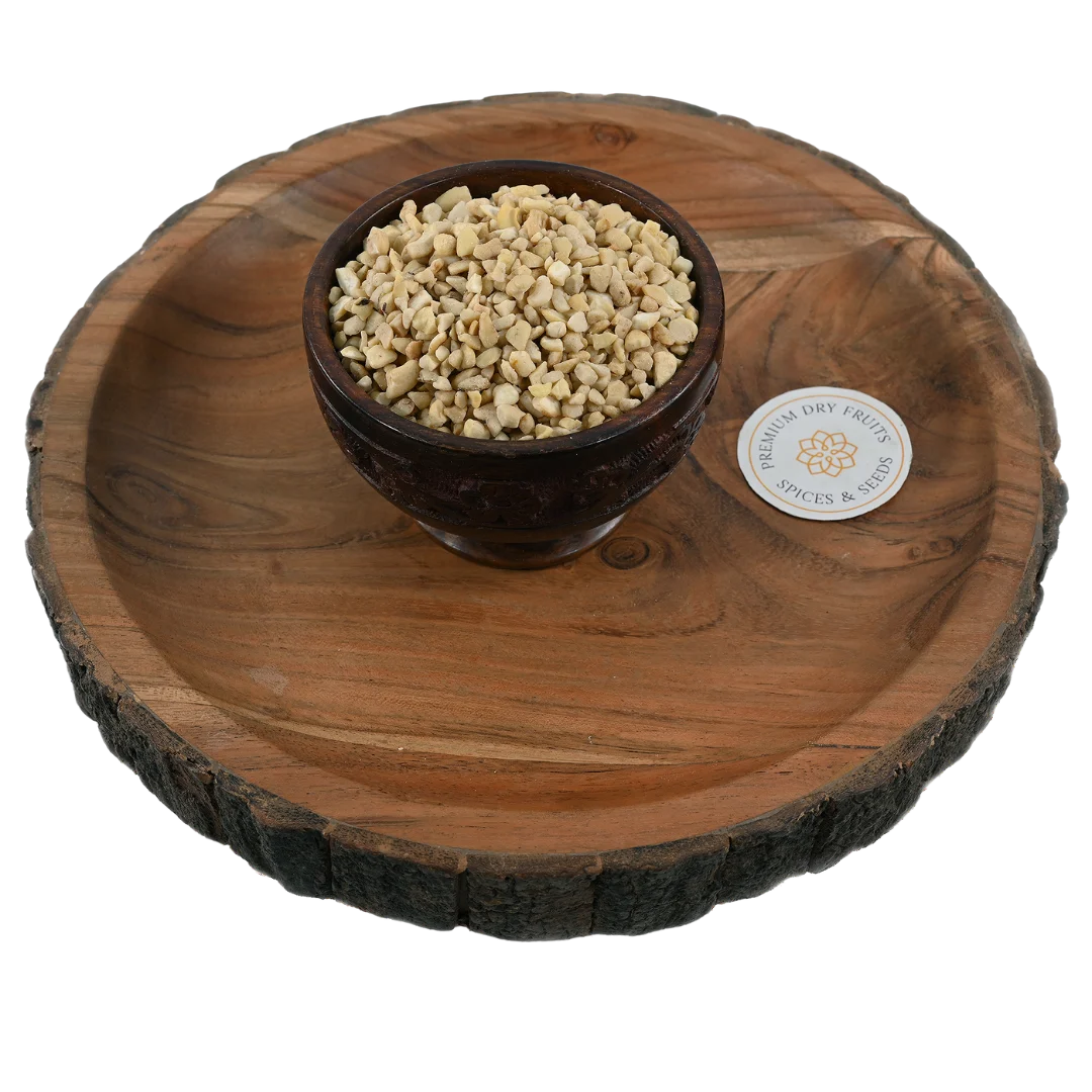 Fresh small cashew nut pieces displayed in a wooden bowl, buy premium dry fruits online in Bangalore from House of Rasda, perfect for sweets and desserts.