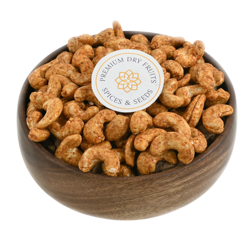 Smoky barbeque spiced cashew nuts served in a wooden bowl, buy flavoured cashews online in Bangalore from House of Rasda, perfect for rich and tangy snacking.
