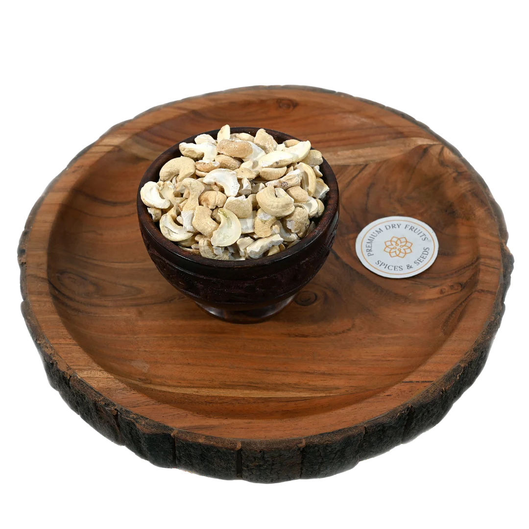 Fresh big cashew pieces displayed in a wooden bowl, buy premium dry fruits online in Bangalore from House of Rasda, perfect for sweets and desserts.