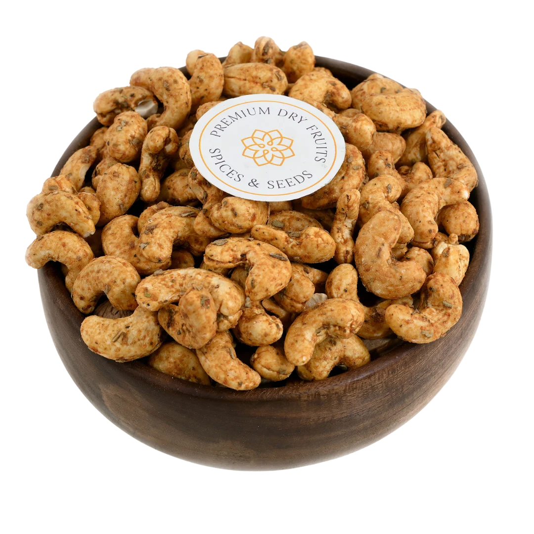 Crispy cashew nuts coated with spicy chilli and garlic seasoning, served in a wooden bowl