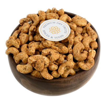 Crispy cashew nuts coated with spicy chilli and garlic seasoning, served in a wooden bowl