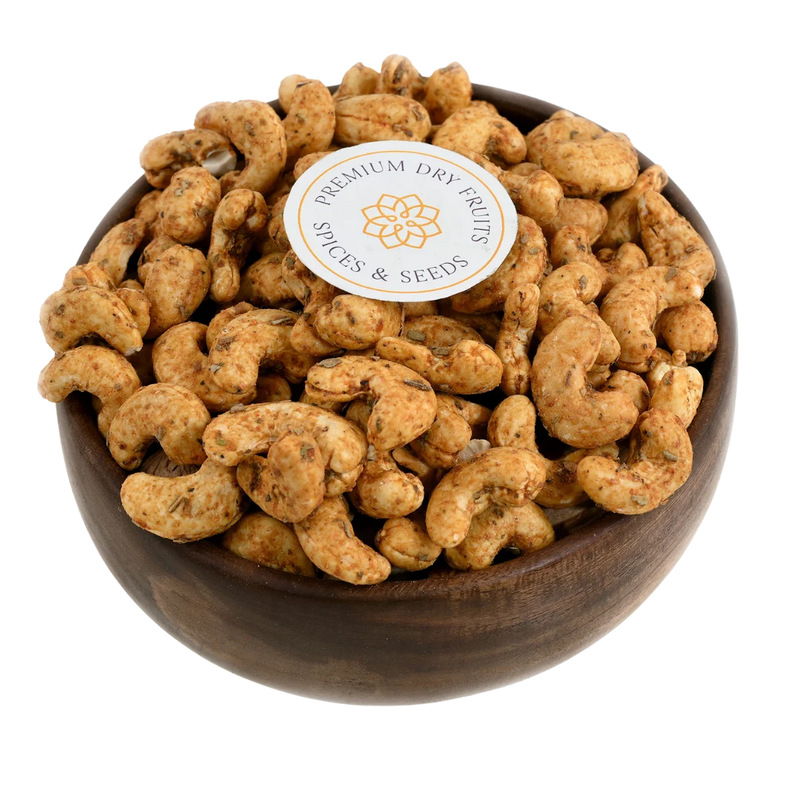 Crispy cashew nuts coated with spicy chilli and garlic seasoning, served in a wooden bowl, buy flavoured cashews online in Bangalore from House of Rasda.