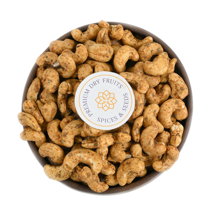 Roasted cashews tossed in tangy chilli garlic spice mix, perfect for snacking and gifting.