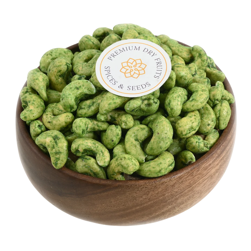 Crunchy green chilli spiced cashew nuts served in a wooden bowl, buy spicy cashews online in Bangalore from House of Rasda, perfect for those who love a tangy heat.