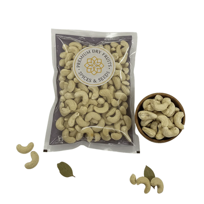 Packaged Cashew Nuts Kernels Choice with a bowl of cashews on a white background