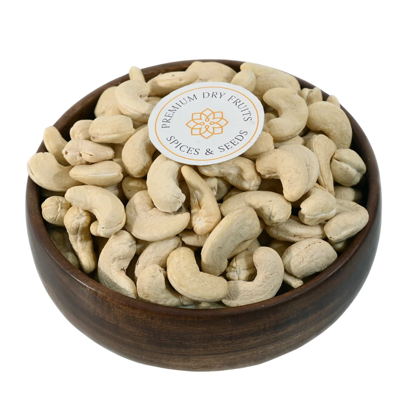 Premium dry fruits displayed in a wooden bowl, fresh cashews perfect for sweets, snacks, and recipes, available online across India from House of Rasda.