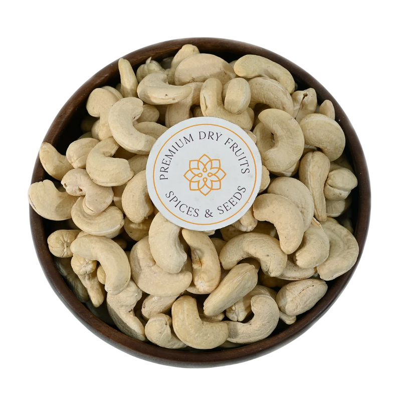 Best quality cashew nuts arranged in a wooden bowl, ideal for gifting and healthy snacking, freshly packed by House of Rasda.