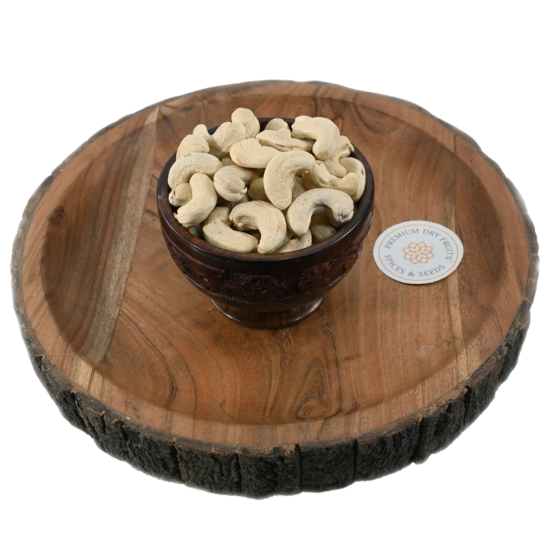 Fresh select-grade cashews displayed in a wooden bowl, rich in protein and healthy fats, buy premium cashews online in Bangalore from House of Rasda.