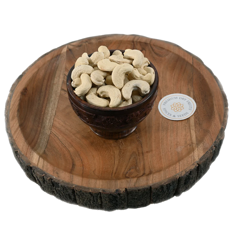 Fresh select-grade cashews displayed in a wooden bowl, rich in protein and healthy fats, buy premium cashews online in Bangalore from House of Rasda.