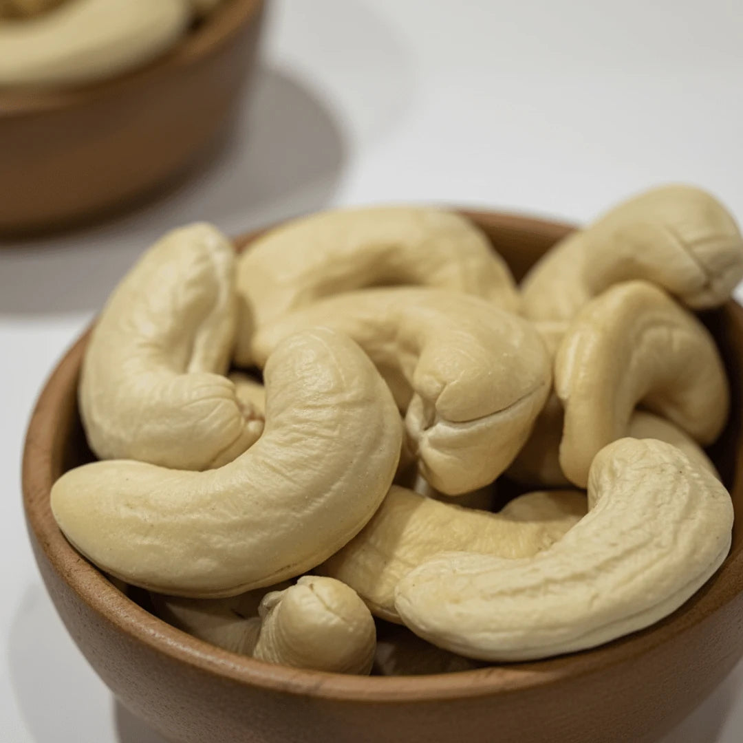 Extra large W150 cashew nuts kernels signature in wooden bowl – creamy whole premium cashews for healthy snacking