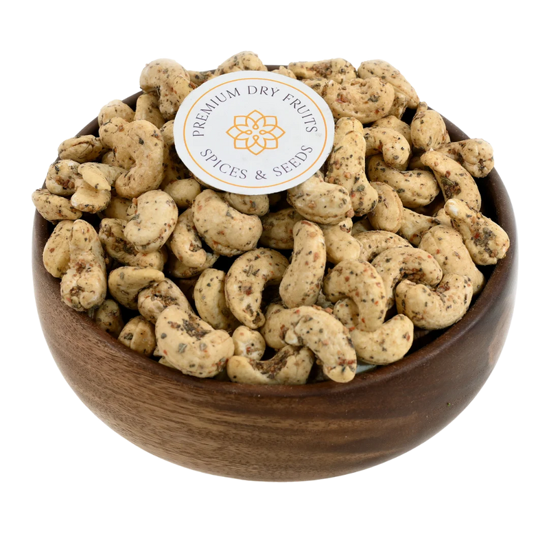 Crunchy oregano spiced cashew nuts served in a wooden bowl, buy flavoured cashews online in Bangalore from House of Rasda, perfect for herb lovers.