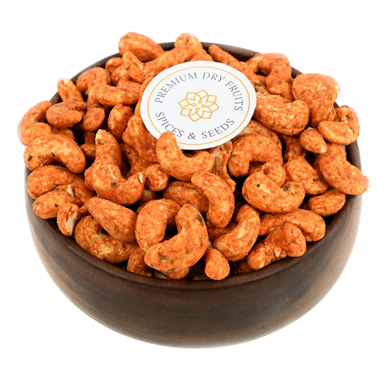 Paneer tikka spiced cashew nuts served in a wooden bowl, buy flavoured cashews online in Bangalore from House of Rasda, bursting with smoky Indian spices.