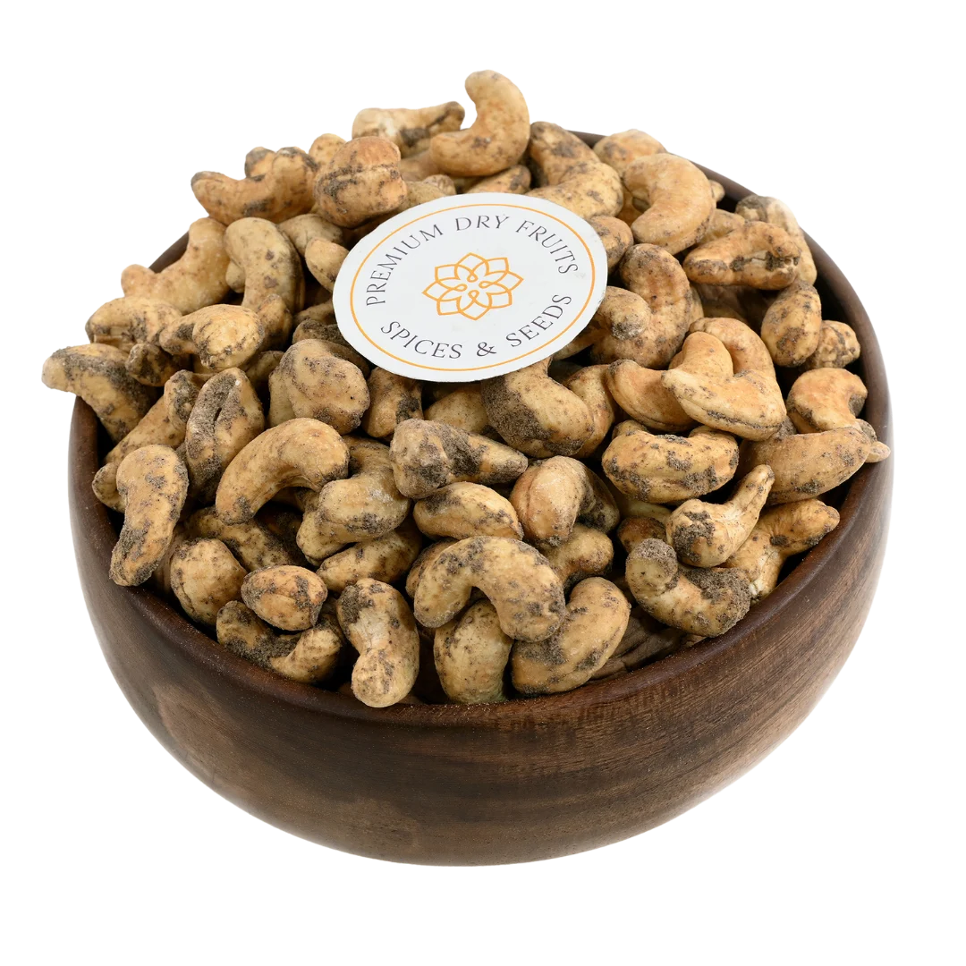 Crunchy cashews coated with bold black pepper spice in wooden bowl - savoury snack