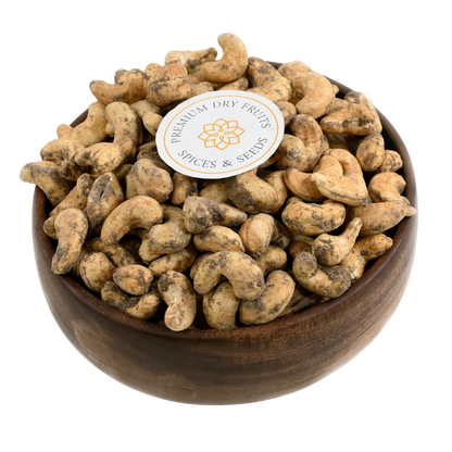 Crunchy cashews coated with bold black pepper spice in wooden bowl - savoury snack