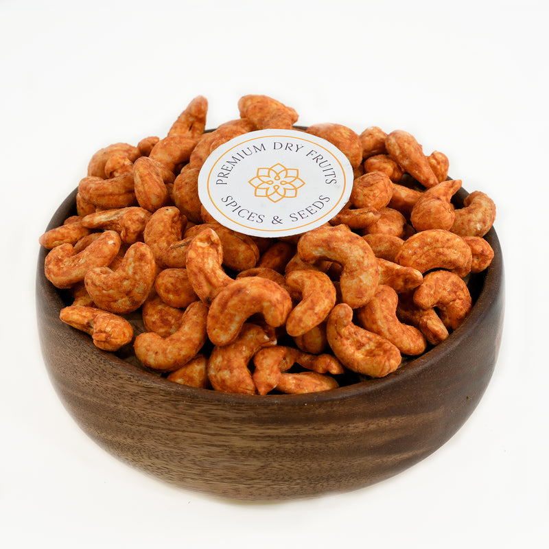 Experience the bold and spicy flavors of our Cashew Peri Peri. Made from all-natural ingredients, these cashews are coated in a fiery blend of herbs and spices for a delicious and nutritious snack. Elevate your taste buds with the unique and irresistible taste of Cashew Nuts Peri Peri Spiced.