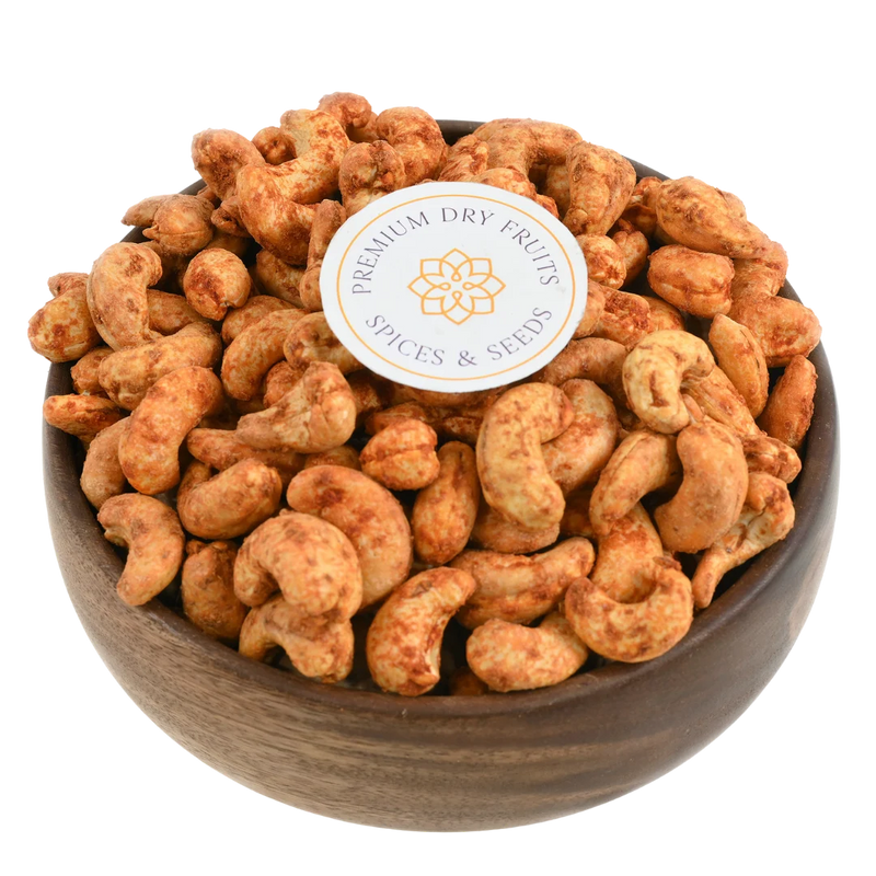 Fiery red chilli spiced cashew nuts served in a wooden bowl, buy spicy cashews online in Bangalore from House of Rasda, perfect for bold flavour lovers.