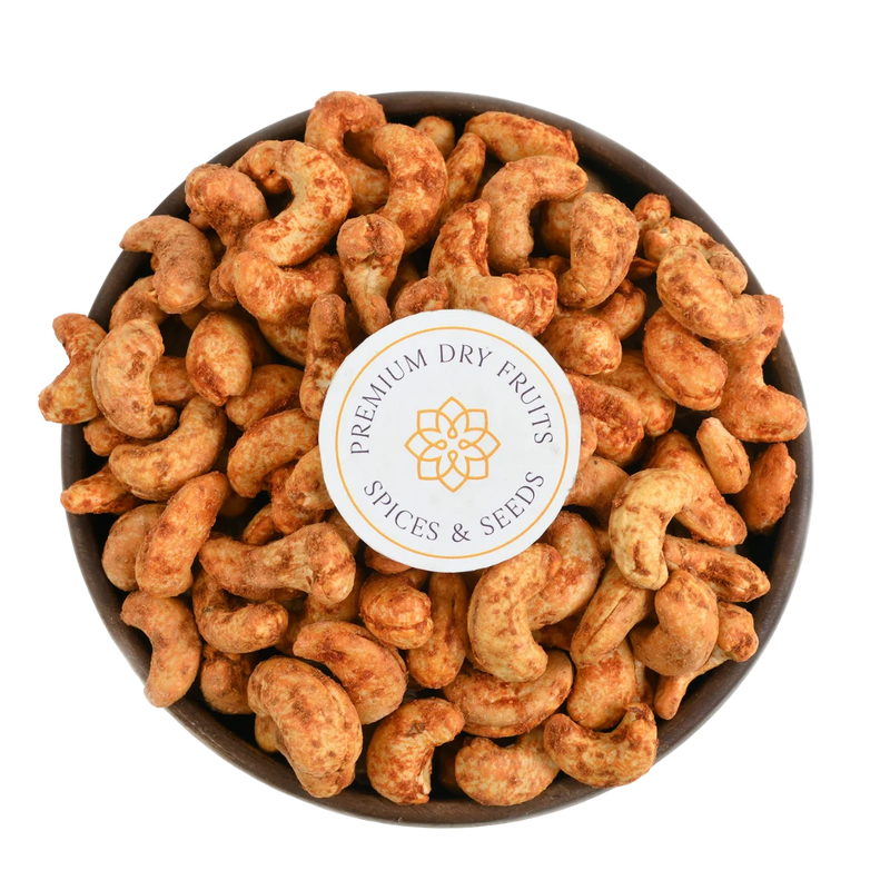 Crunchy roasted cashews coated with natural red chilli seasoning, freshly packed by House of Rasda Bangalore, ideal for spicy snacking and gifting.