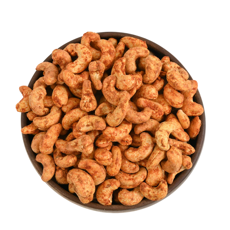Hot and spicy cashew nuts with a vibrant red chilli coating, flavoured dry fruits from House of Rasda, perfect for parties, travel, and anytime snacking.