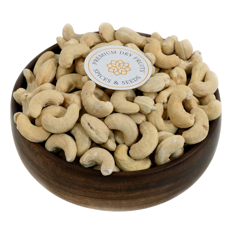 Golden roasted and salted cashew nuts served in a wooden bowl, buy premium roasted cashews online in Bangalore from House of Rasda for healthy snacking.