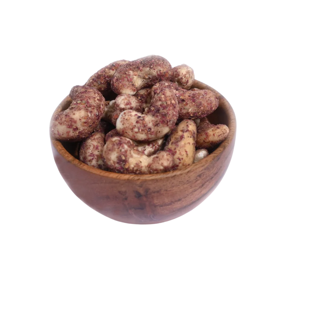 Wooden bowl filled with Cashew Nuts Rose Petal on a white background
