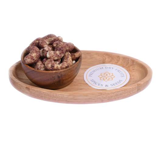 Wooden bowl with dried fruits(Cashew Nuts Rose Petal) on a wooden tray with a visible brand label.