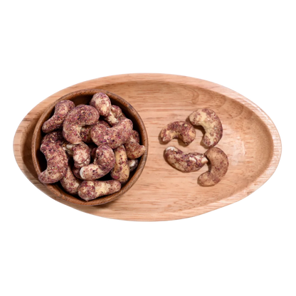 Wooden bowl filled with Cashew Nuts Rose Petal on a wooden tray
