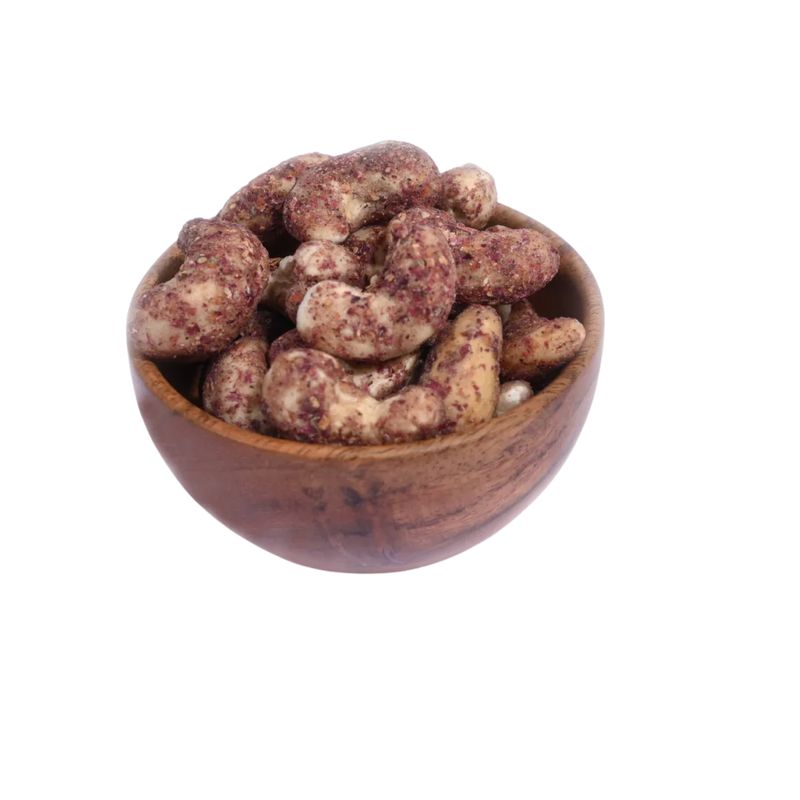 Wooden bowl filled with Cashew Nuts Rose Petal on a white background