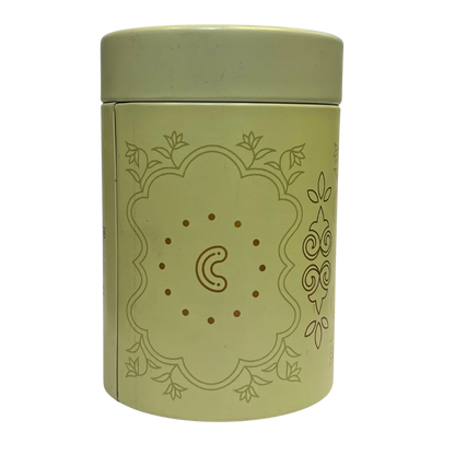 Green cylindrical container with Cashew flavour decorative design on a white background