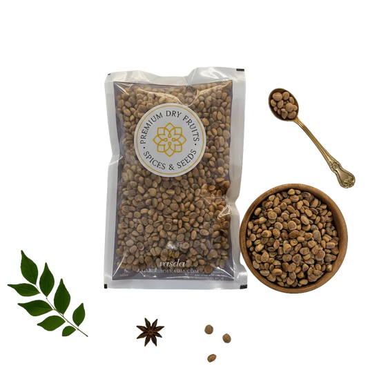 Packaged Charoli Seeds with a bowl and spoon on a white background