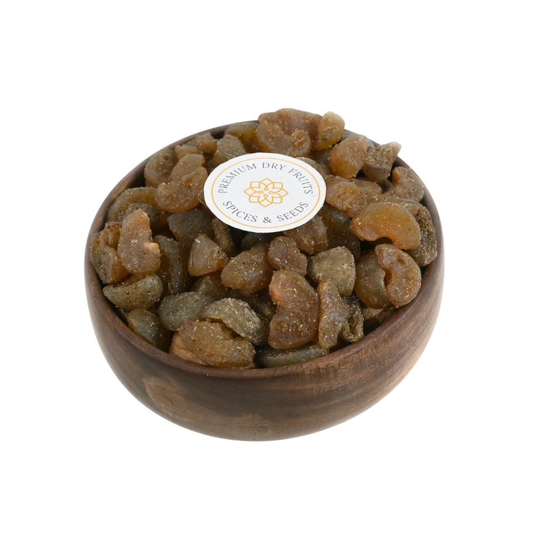 Chatpata Amla Dried Candy in a rustic wooden bowl on a neutral background.