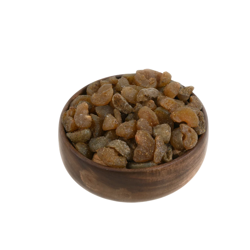 Top view of Chatpata Amla Dried Candy arranged neatly in a wooden bowl.