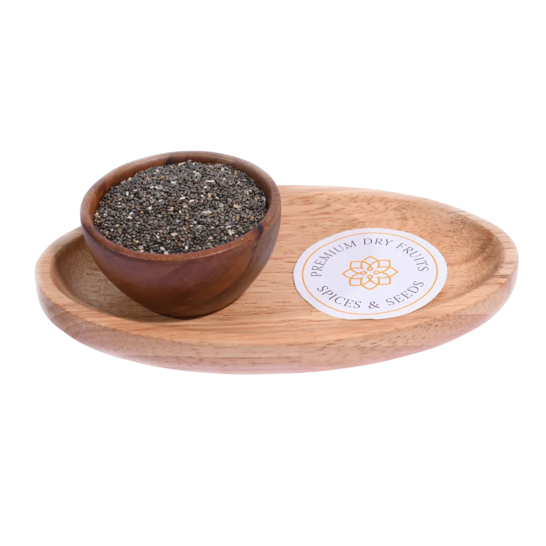 Wooden bowl with chia seeds on a wooden tray with a label, on a white background