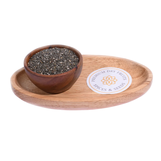 Wooden bowl with chia seeds on a wooden tray with a label, on a white background