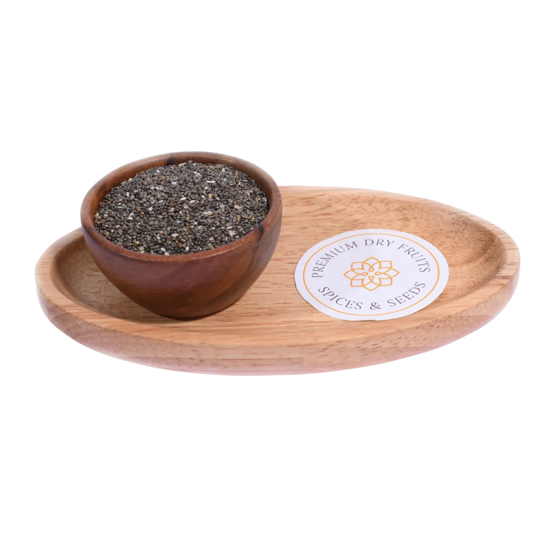 Wooden bowl with chia seeds on a wooden tray with a label, on a white background