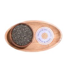 Wooden bowl with chia seeds and a 'Spices & Seeds' label on a white background